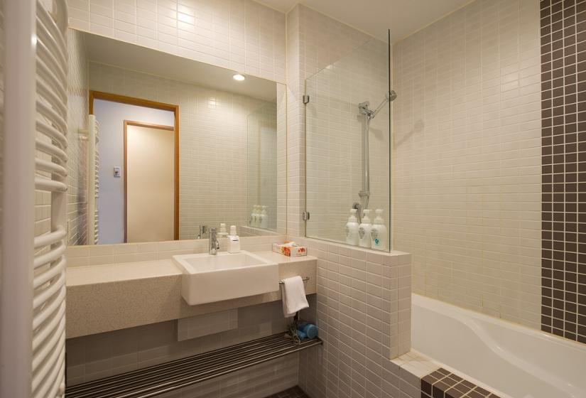 white tiled bathroom and sink