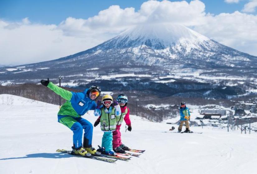 The kids learnt to ski in Niseko! A ski lesson with Go Snow with Mount Yotei in the back ground