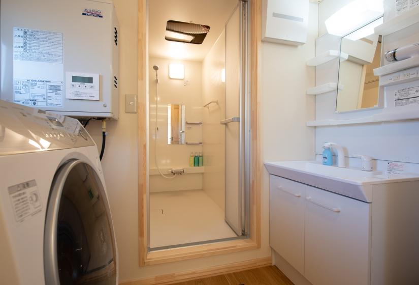 Unit shower with white vanity