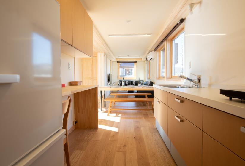 View towards dining area from narrow kitchen