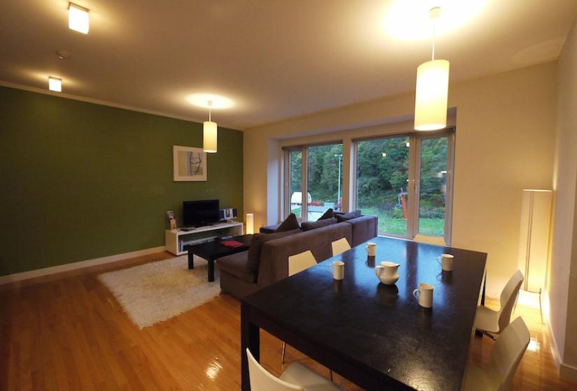 close up of dining table with living area in the background