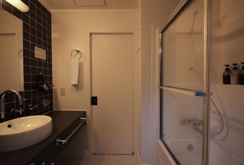 view of shower and sink in the restroom