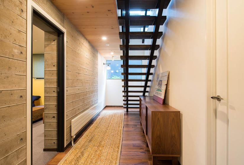 hallway with stairs and bookcase