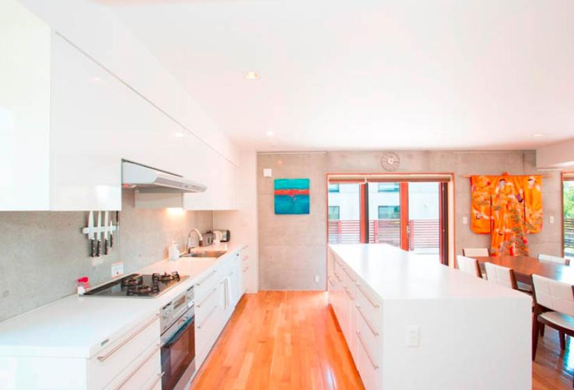 kitchen with stove, counter, drawers, white trim