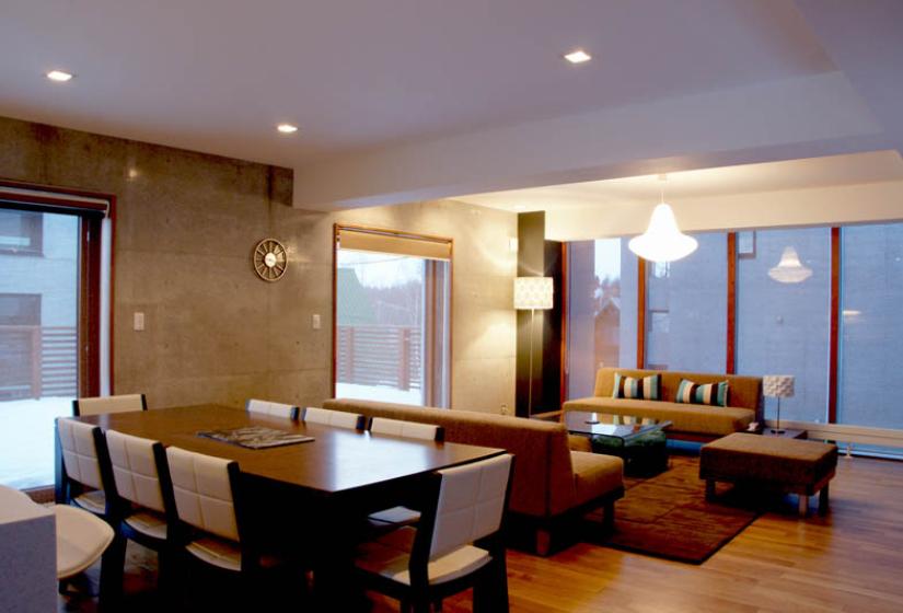 dining table with living space and ceiling lights
