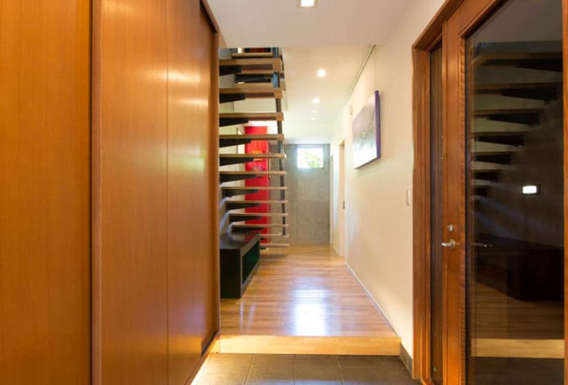 entrance hallway with stairs and shoe closet