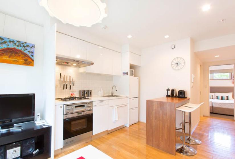 studio kitchenette with oven, stove and sink