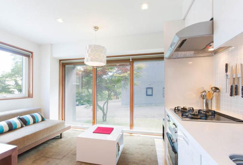 living area with kitchenette and window views