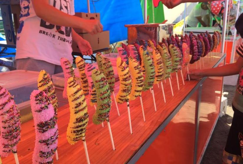 Delicious festival food for the kids Brightly coloured candied bananas
