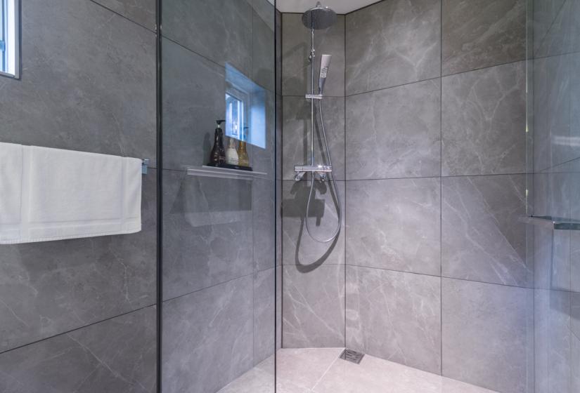 standing shower with glass door