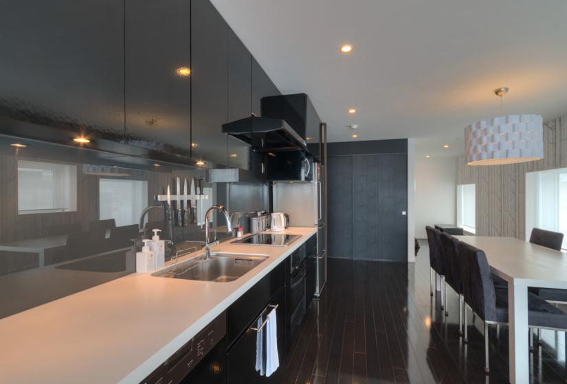 living area with dining table and kitchen