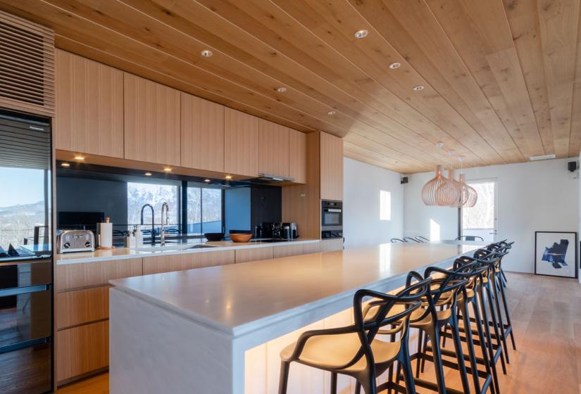 kitchen with bar table and stools