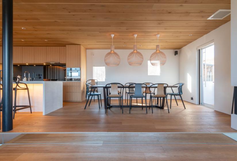 main dining table below large hanging lights