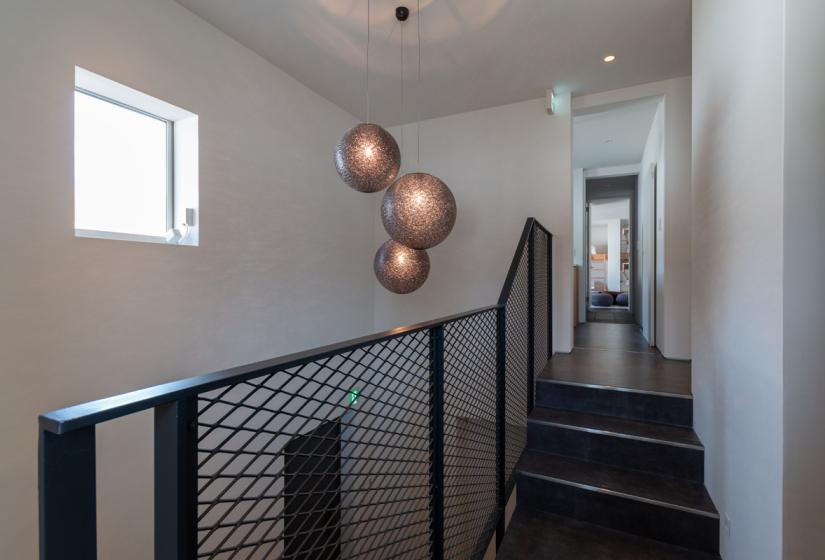 decorative lights and railing in hallway