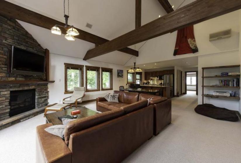 lounge suite and windows behind Large brown couch and windows behind