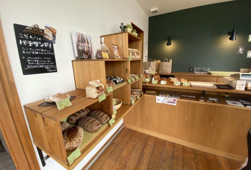 Delicious french bread The interior of a stylish bakery with shelves of bread