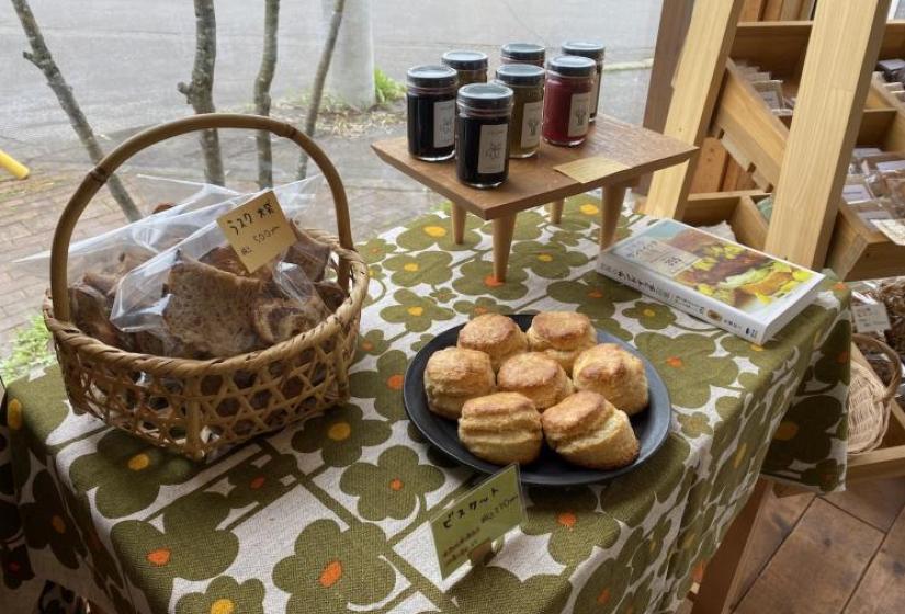 A tasty selection of treats Bread and jams on a flowery table cloth
