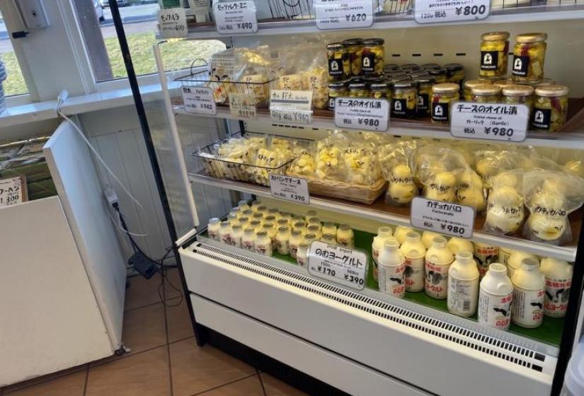A range of dairy products in a display fridge