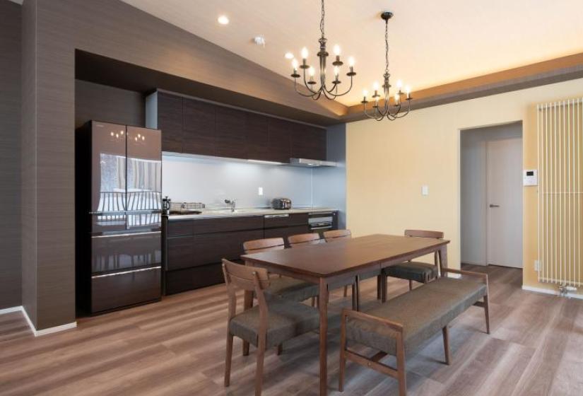 Mountain Butterfly kitchen and dining Brown dining table and black chandilers
