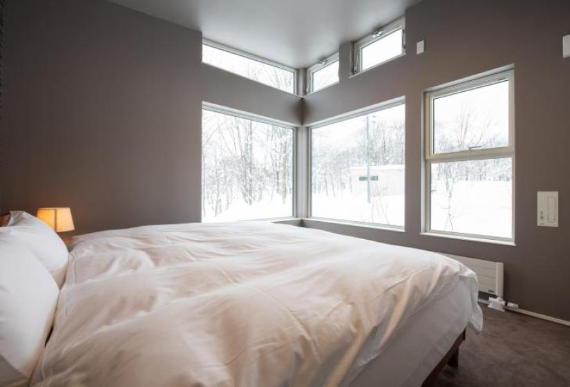Mountain Butterfly Double bed with outside snowy view