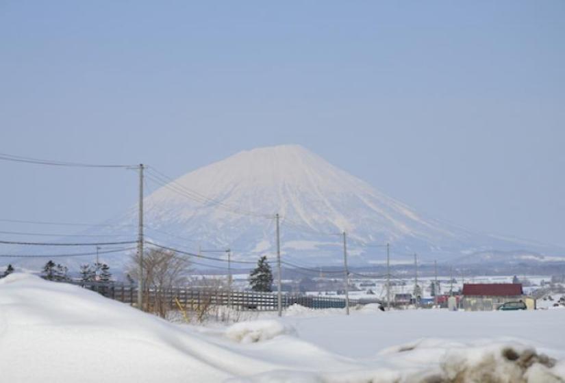 Mount Yoeti from afar A view of Mount Yotei intersected by powerlines