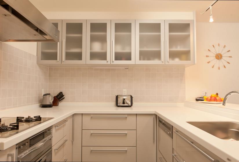 kitchen stove, oven, sink, and counter space