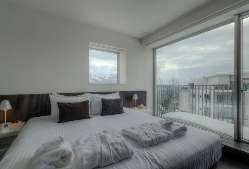 penthouse double bed with clean towels and robes