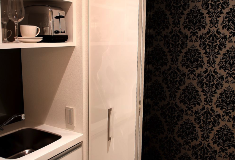 kitchenette with toaster, sink and coffee cup