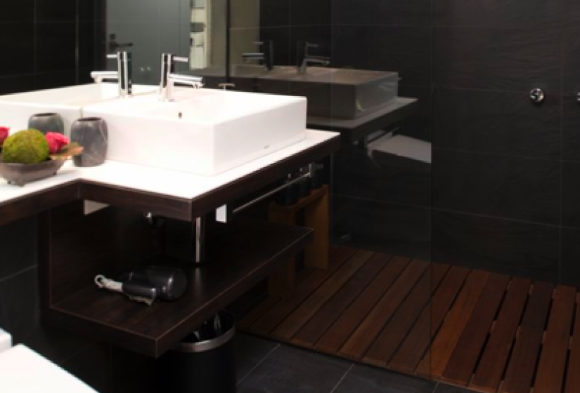 japanese toilet, sink, large mirror and shower