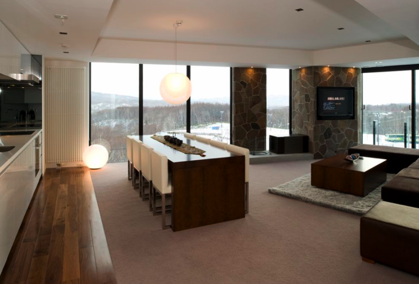 dining area with white chairs and lamp fixture