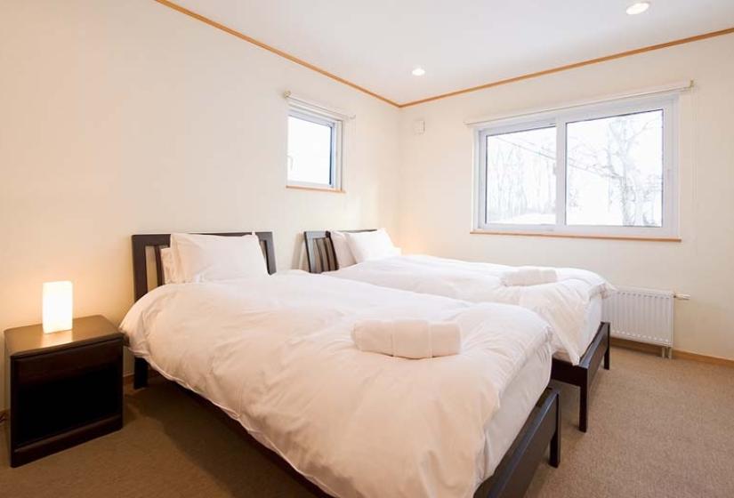 twin bed set up in spacious room of modern Japanese home