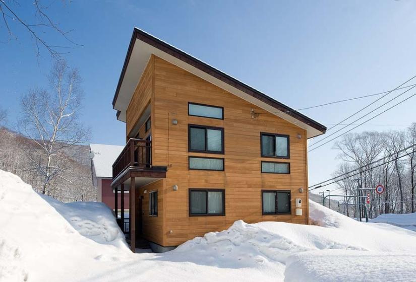 exterior of Ruby Chalet on blue sky winters day