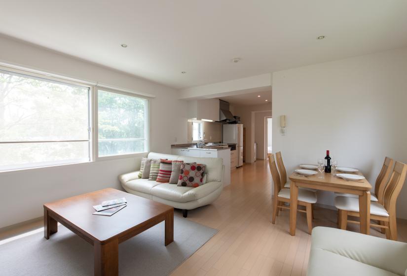 Living room couch and table with dining table using white crockery