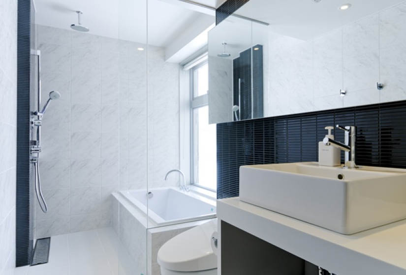bathroom includes sink, toilet, a tiled shower, and bath tub