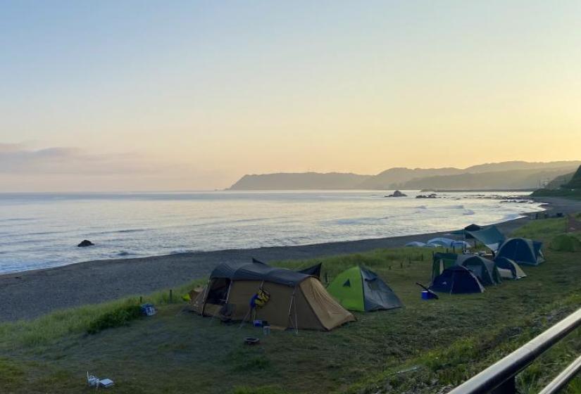 Tents on the beach at sunrise