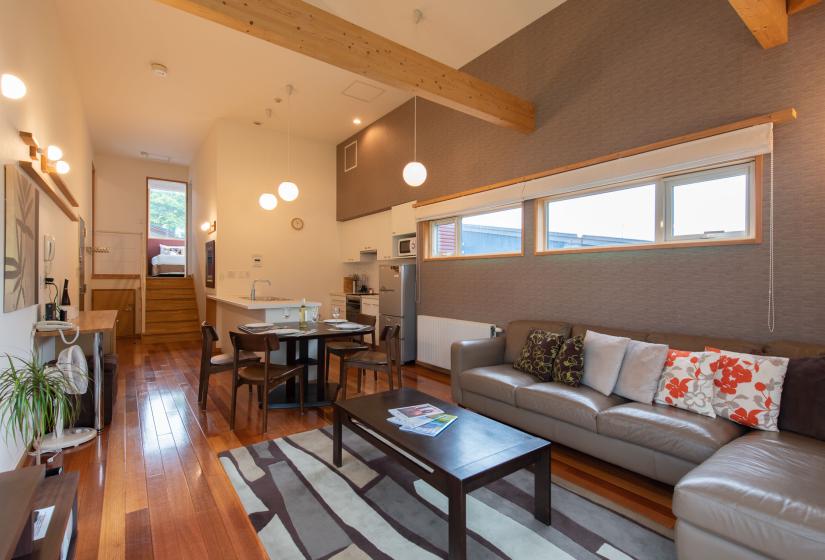 Brown coffee table on patterned rug