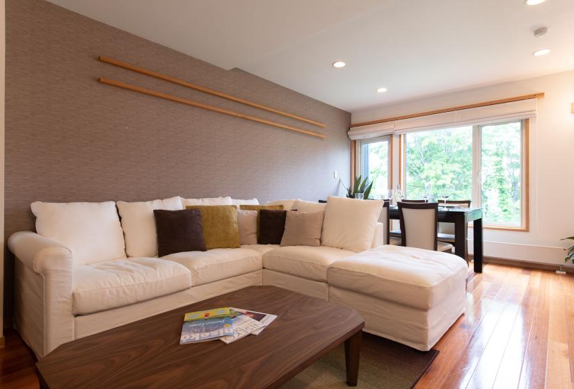 White Sofa with brown cushions and brown coffee table