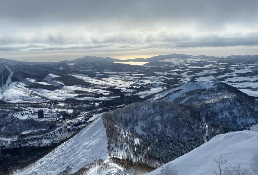 Beautiful light and fantastic snow Lake Toya from Mount Shiribetsu, Niseko