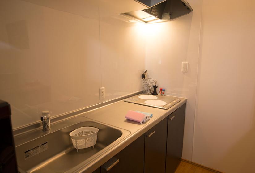 kitchen bench close up showing sink and cook top in Snowbird apartments