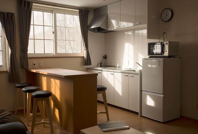 sunny kitchen bar and kitchen bench area