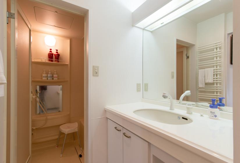 White vanity unit with large mirror