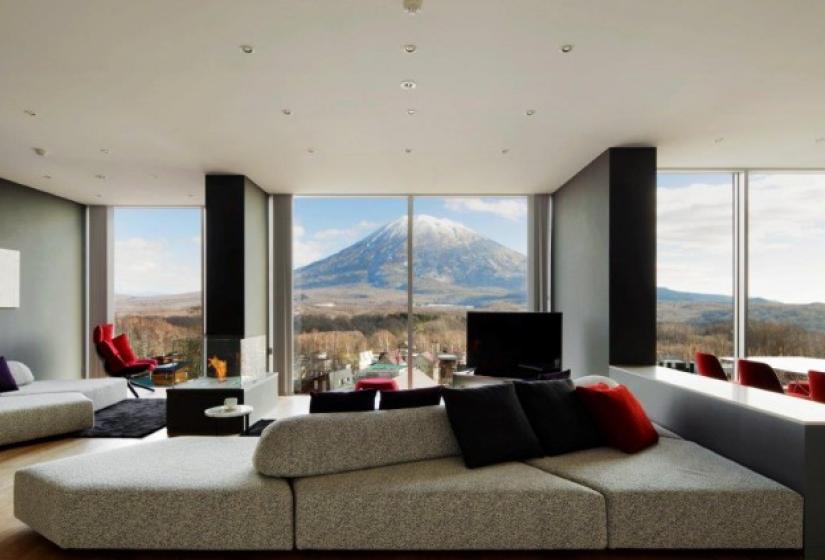 Light brown sofa with mountain view from Penthouse suite