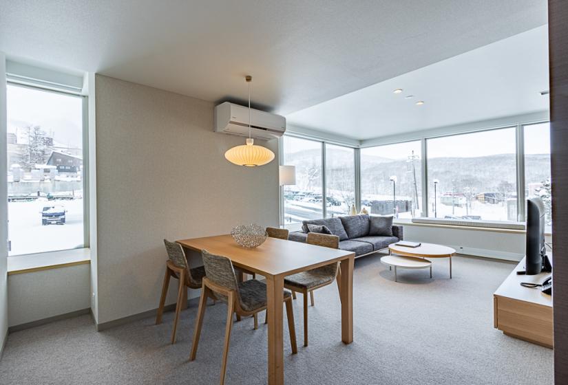 Room with dining table couch and coffee table 