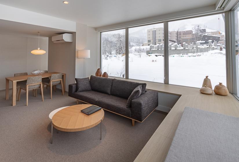 Room with round coffee table and black couch