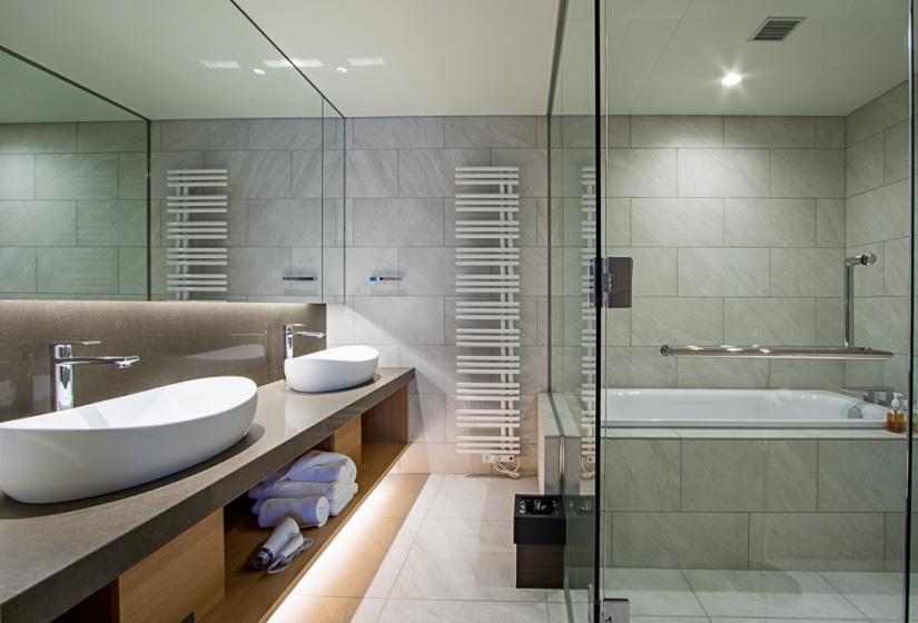 Bathroom with bath and two hand basins