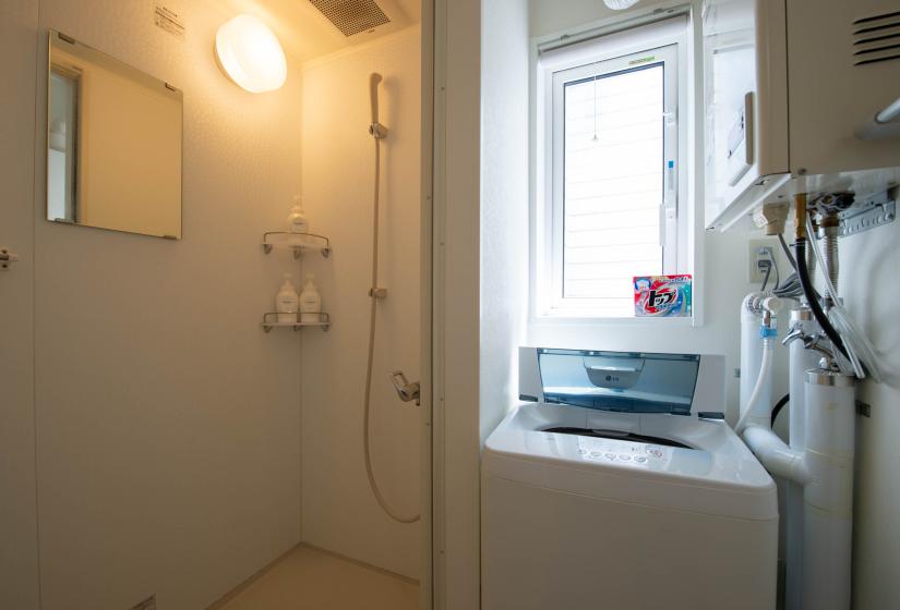 Unit shower and washing machine beside it