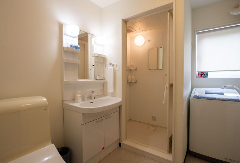 white vanity and unit shower