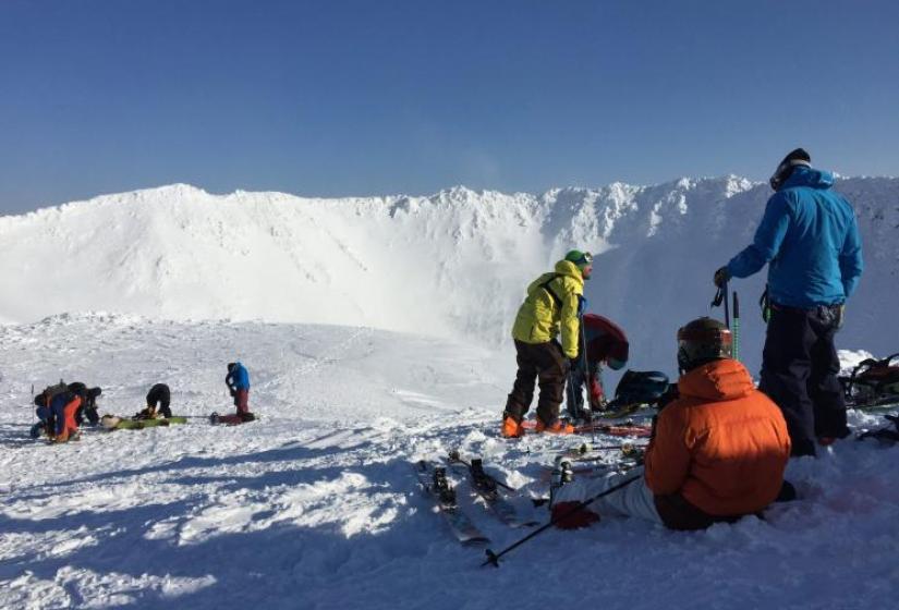 Awesome terrain at the peak of Mt Yotei Skiers and snowboarders prepare at the Yotei crater