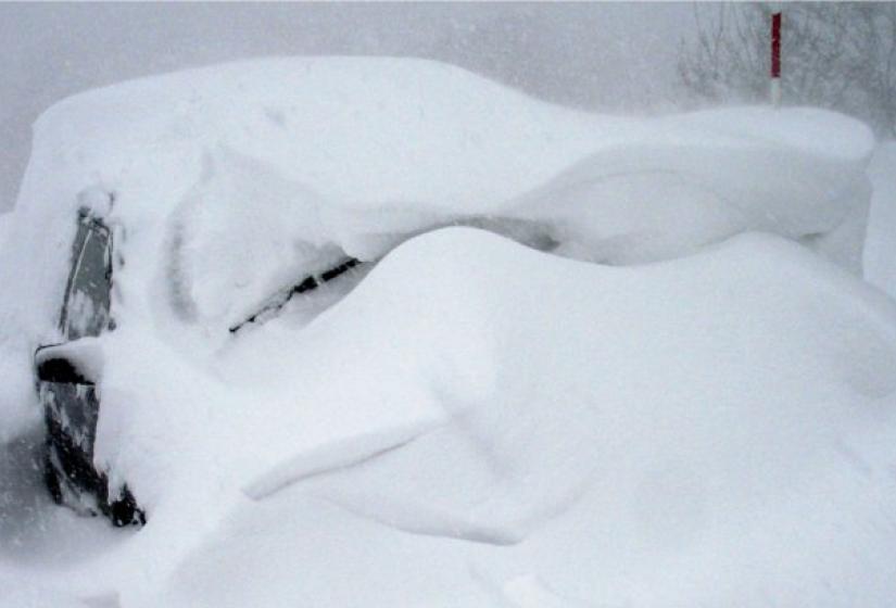 A car covered in snow 