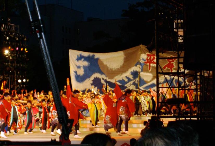 Yosakoi dancers on a stage.